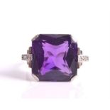 An Art Deco amethyst and diamond ring centred with a radiant-cut amethyst weighing approximately