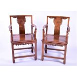A pair of Chinese hardwood throne chairs designed with carved and pierced scrolled cloud decoration,