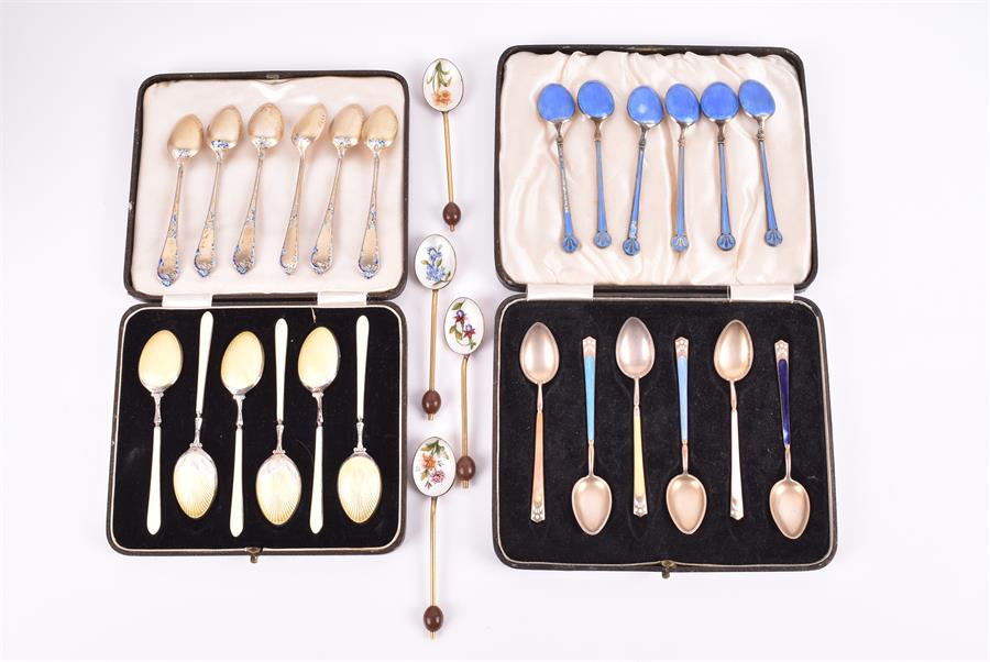 Four sets of six various silver and enamel spoons polychrome decorated, together with a set of