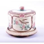 A Victorian majolica cheese dish and cover possibly by Wedgwood, decorated with ribbon tied