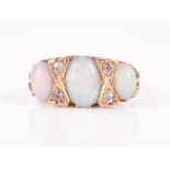 An 18ct yellow gold, diamond, and opal ring set with three oval cabochon opals, interspersed with