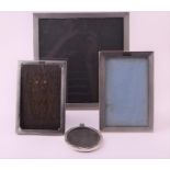 Four assorted George V silver photograph frames the largest of squared form, Birmingham 1928, with