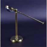 A 19th century magnifying glass on brass stand of plain cylindrical form, with swivel adjustment and