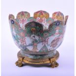 A large ormolu mounted Chinese famille verte porcelain punch bowl probably Kangxi period, the finely