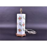 A 20th century Chinese hexagonal porcelain lamp decorated with butterflies and flowers on a white