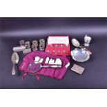 A collection of assorted silver items including napkin rings, a Georgian silver fish slice, a