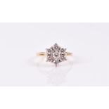 An 18ct yellow gold and diamond daisy cluster ring the seven diamonds approximately 1.10 carats