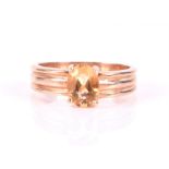 A 14ct yellow gold and yellow topaz ring size P, 4.4 grams.