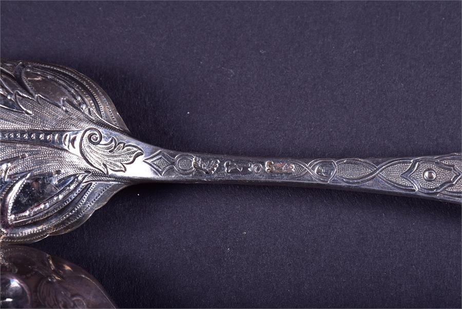 A collection of 18th century and later silver fruit spoons comprising one trio and two pairs, - Image 9 of 9