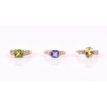 A 9ct yellow gold and tanzanite ring size N 1/2 together with a 9ct yellow gold and Xia yellow