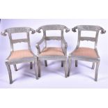 A set of three Indian tin-banded chairs comprising one carver and two standard chairs, decorated