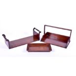 Four 19th century mahogany book troughs one with turned handles, two of basket form, and one of tray