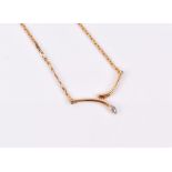 An 18ct yellow gold wishbone-style necklace set with two diamond accents, on flattened link chain,