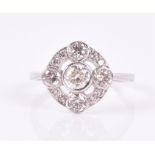 A diamond cluster ring the open rounded mount set with five round brilliant-cut diamonds, the border