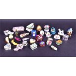A large group of Limoges porcelain miniature trinket boxes comprising fruit, scent bottles, a piano,