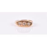 An 18ct yellow gold and diamond ring the mount inset with three old-cut diamonds, approximately 0.40