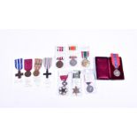 A collection of WWI, WWII and later medals including a WWI Merit Cross, an Italian Medal of