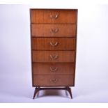 A 1960s Meredew 'Tola' six drawer chest of drawers or cabinet, with African Tola veneer, on a shaped