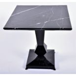 A late 20th century marble-topped pedestal table the white variegated black square marble top