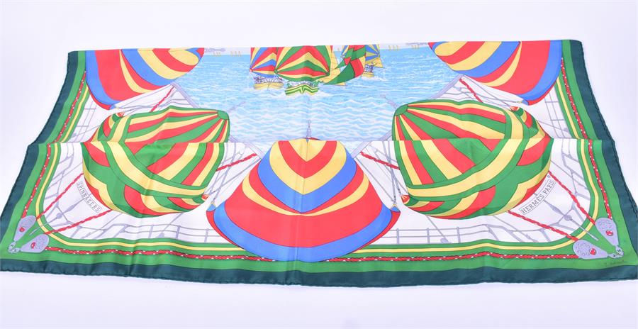 A Hermes silk scarf in the Spinnakers pattern decorated with boats and sails, together with a Dior - Image 4 of 6