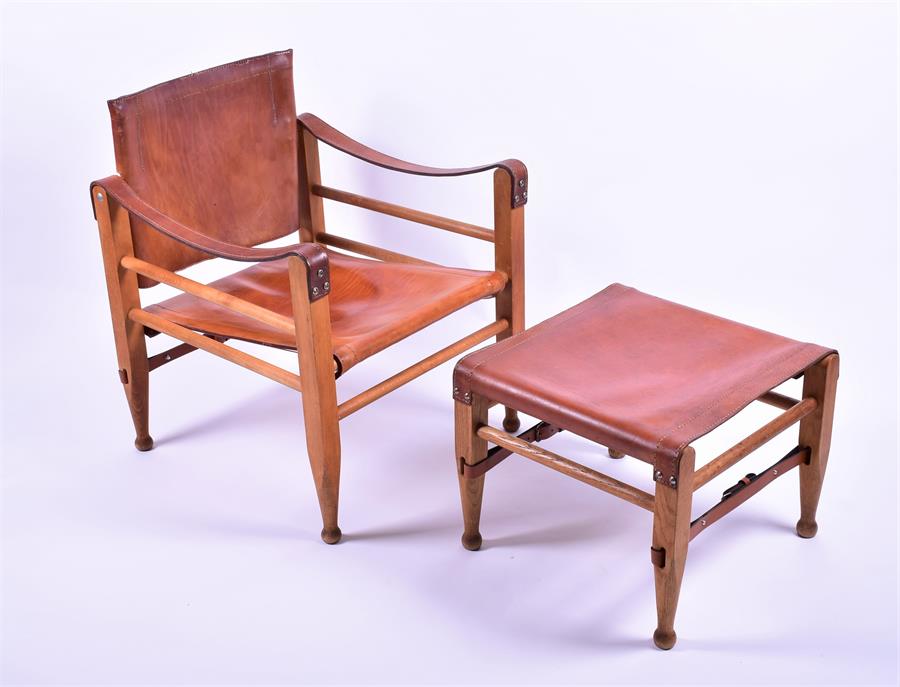 A 1950s-60s Danish Fredericia oak and brown saddle leather Model 2221 Safari chair, with rare