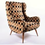 An interesting late 1940s or early 1950s armchair, the curving form with strips of bent ply wings on