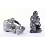 Two hand carved soapstone Inuit sculptures by Nuluki, one of 'Fisherman with catch' depicting an