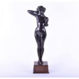 A large early 20th century French Art Deco bronze sculpture realistically modelled as a nude woman