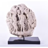 An early carved lime stone fragment circa 13th century, carved with a religious figural scene with