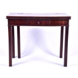 A George III mahogany fold over card table the single front drawer with brass ring drop handle,