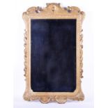 A Georgian style gilt framed mirror modelled with moulded gilt-gesso scrolls and acanthus leaves,