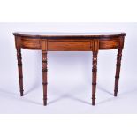 A large Regency mahogany console table the shaped top above a single central fitted drawer, with