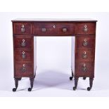 A Regency mahogany lady's desk the top frieze with central drawer flanked either side with four