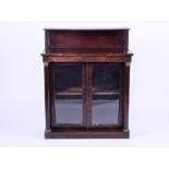 A late Victorian rosewood chiffonier the two doors flanked by cylindrical columns and brass