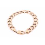 A 9ct yellow gold flattened curb-link bracelet 22 cm long. CONDITION REPORT 37.5 grams