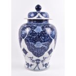 A Chinese Qing dynasty export blue and white vase with cover of baluster shape, with floral and