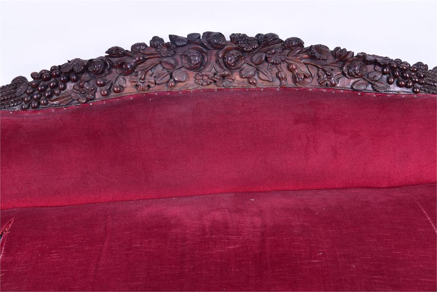 A 19th century European rosewood sofa the low back and frame with detailed carved fruit and - Image 16 of 26