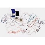 A miscellaneous collection of silver, white metal and costume jewellery to include bangles, pearl