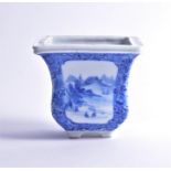 A Chinese blue and white porcelain incense burner of tapering squared form, painted with landscape