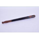 A Victorian or earlier painted constabulary truncheon with a turned gridded handle, painted with