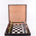 A South African political chess set and board in the original case sculpted and designed by Darren