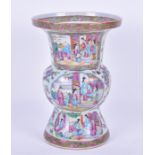 A 19th century Cantonese Gu shaped vase decorated in the famille rose palette, with reserves