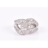 An 18ct white gold and diamond double-loop ring the mount pave-set with round-cut diamonds, size