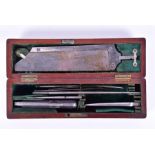 A 19th century mahogany cased campaign amputation set and an early 20th century chemist's set the