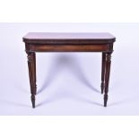 A Victorian rosewood fold-over card table with beaded borders in the Regency manner, opening to