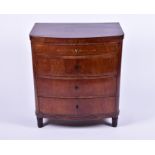 An Edwardian mahogany and inlaid bow-front chest with four graduated drawers on turned legs, 73 cm x