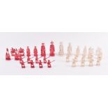 A 19th century Cantonese figural ivory chess set finely carved in white and red stained ivory,