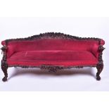 A 19th century European rosewood sofa the low back and frame with detailed carved fruit and