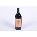 A five litre bottle of 1981 Chateau Gros Caillou, St Emilion with chipped wax seal, 48 cm high x 15