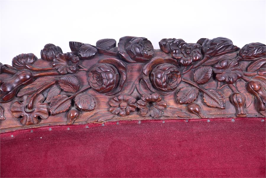 A 19th century European rosewood sofa the low back and frame with detailed carved fruit and - Image 5 of 26